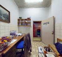 Office space with wooden decoration, painting, and storage space.