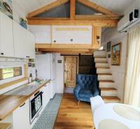 A stylish kitchen with a seating area in a family house with a wooden decor floor.