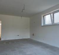 Interior of a family house with a window, white walls, and electrical installation operation.