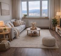 Living room in a 3-room apartment with a wooden decor floor and comfortable seating.