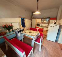 A kitchen in a family house with antique furniture and decorative elements.