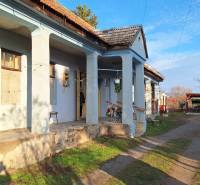 A family house in Rapovce with a veranda and sunlight illumination.