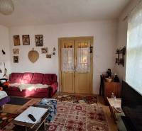 Living room in a family house with antique furniture and decorations, floor with wooden decor.