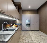 A kitchen in a 3-room apartment with a tiled floor and appliances.