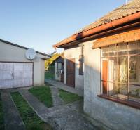 A family house on Pod kopcom Street in Nové Zámky with a garage and a satellite dish.