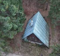 A cabin in the forest at Krpáčovo surrounded by dense trees on Krpáčovo street.