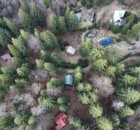 An aerial view of cabins surrounded by forests in Krpáčovo at Krpáčovo.