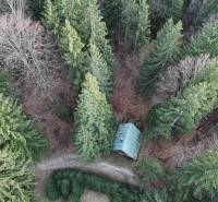 Aerial view of a cabin surrounded by forest in the town of Krpáčovo on Krpáčovo Street.