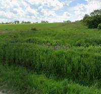 Land for residential use in Lomnicka, Vranov nad Topľou, with grassy area and hilly landscape.