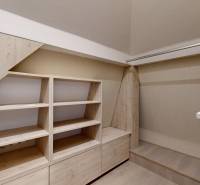 Storage spaces with wood-patterned flooring in a 4-room apartment.