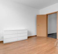 A room with light furniture and a wood-patterned floor in a 3-room apartment.