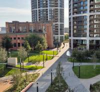 Modern buildings and greenery on Bottova Street in Bratislava, near 2-room apartments.
