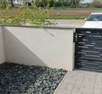 Part of a 3-room apartment in Diakovce, a terrace with tiles and decorative stones.
