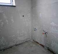 Plastered wall and preparation for installations in a family house.
