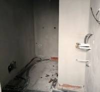 The interior of a family house during renovation with visible wiring and unfinished walls.