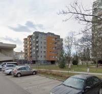 Terézia Vansová Street in Trnava with commercial spaces and parking.