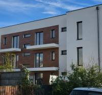 White building with wooden details on Banka Street in Piešťany.