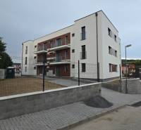 Three-story apartment building with a fence on Banka Street in Piešťany.