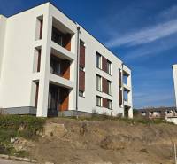 New buildings on Banka Street in Piešťany with a combination of white facade and wooden decor.