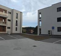 New buildings near Banka Street in the town of Piešťany with a parking lot and balconies.