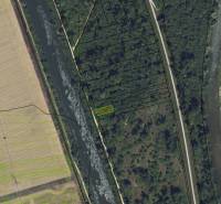 An aerial view of recreational lands in Nová Ves nad Váhom, surrounded by bodies of water.