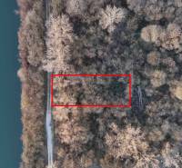 Aerial view of recreational grounds in Nová Ves nad Váhom, surrounded by forest and river.