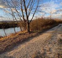 Recreational plots in Nová Ves nad Váhom with a natural road and river in autumn.