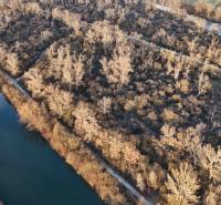 A river surrounded by trees on recreational grounds in the town of Nová Ves nad Váhom.