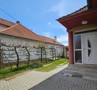 In Križovany nad Dudváhom, a family house with a tiled floor and a garden is visible.