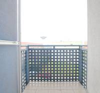 Balcony in Galanta from a 2-room apartment with railing and tiles, view of the city.