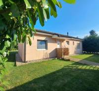 A family house in Čierny Brod surrounded by greenery and a well-maintained lawn.