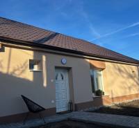 A family house in Blatné with a brown roof and a light facade.