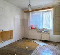 Necessary renovation of a room in a family house, preserving natural light from the window.