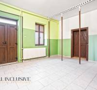 Green walls and white tiles in the family house.