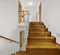 A staircase with a wooden decor and railing in a family house.