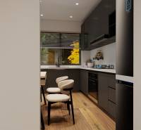 A kitchen in a 3-room apartment with black cabinets and a wooden decor floor.