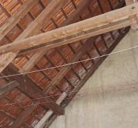 A view of the roof structure in a family house with a brick covering.