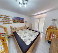 Children's room in a two-room apartment with a crib and a child's bed, floor with wooden decor.