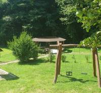 Garden with a swing and a shelter on Hviezdoslavova Street in Tisovec near the cottage.