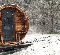 Snow-covered barrel-shaped cottage on Hviezdoslavova Street in Tisovec.