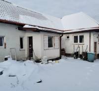 Family house on Hájska Street in Martin, snowy view of the yard and roof.