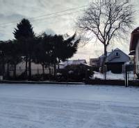 A family house on Hájska Street in Martin with a gate and a snowy yard.