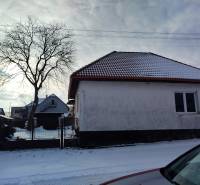 A family house on Hájska Street in Martin with a snow-covered roof and garden.