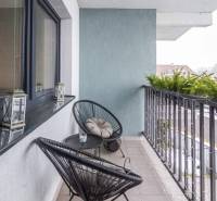 A balcony of a family house with comfortable chairs and a table, Krátka Street, Spišské Bystré.