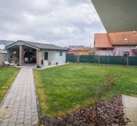 The garden at the family house on Krátka Street in Spišské Bystré with a gazebo and a walkway.