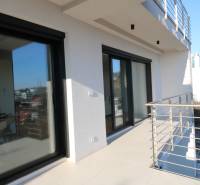 The balcony of a 4-room apartment on Broskyňová Street, Bratislava - Staré Mesto, with modern railings.