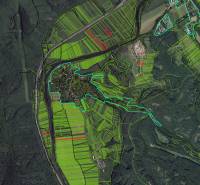 Aerial view of agricultural and forest lands in the Žarnovica area with prominent green areas.