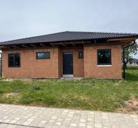 A family house on M.R. Štefánika in Madunice with basic brick walls and a dark roof.