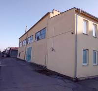 Building in Trnava on Coburgova Street, suitable for warehouses and halls.