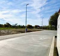 Cintorínska Street in Malinovo, the right side shows a paved road near the Family House.